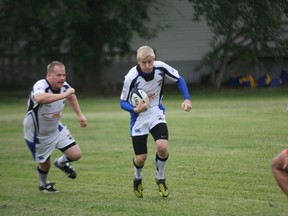 Sean Anderson of the Fort McMurray Knights carries the ball upfield during the first half of play against the Strathcona Druids on Saturday in Sherwood Park