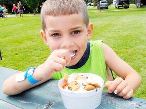 Liam Morimoto, six, of Hamilton was in Wellington Park on Sunday for the 15th annual Ice Cream Fest. Live music has become a hit at the two-day festival. (Daniel R. Pearce SIMCOE REFORMER)