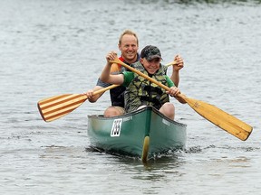 Kyle Parsons, at front, and dad James Parsons arrive at Mattawa Island Conservation Area Saturday after completing the Mattawa River Canoe Race family event. JORDAN ERCIT/The Nugget