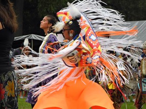 A native dancer transforms into a swirling rainbow of colour at the 34th annual Champion of Champions powwow at Chiefswood Park on Six Nations on the weekend. (HEATHER IBBOTSON, The Expositor)