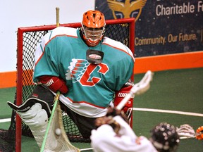 Chiefs goalie Brenner Jacobs makes a save on an Oakville Rock player Sunday during Major Series Lacrosse action at the Iroquois Lacrosse Arena. (Darryl G. Smart, The Expositor)