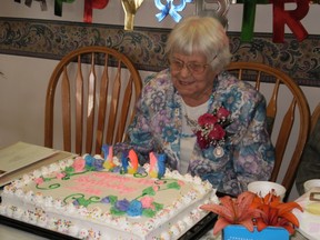 Ina Virtue Barker blows out the candles on her cake at her 105th birthday celebration on July 27, 2013 at the North Haven Care Home in Smeaton.