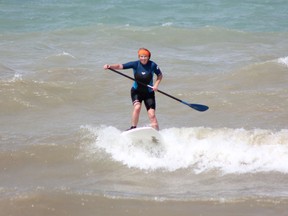 Kincardine-native Alex Johnstone, now of Hamilton, took to the wind waves on her stand up paddleboard (SUP) at Station Beach on Sunday, July 28, 2013.