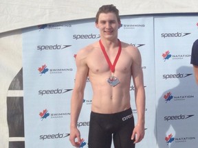 Fort McMurray swimmer Josh Dow poses with the silver medal he won in the 16-and-under 100 metre backstroke event at Age Group Nationals in Montreal. Dow also won a gold medal in the 50 metre backstroke competition and a silver medal in the 50 metre freestyle.