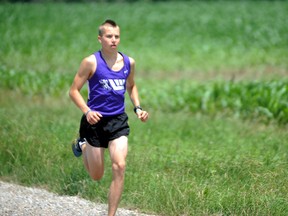 Connor Black jogs along a gravel road near his home in Forest. Black, 17, will take part in the Canadian National Youth Track and Field Championships beginning Aug. 7 in Langley, B.C. PAUL OWEN/THE OBSERVER/QMI AGENCY