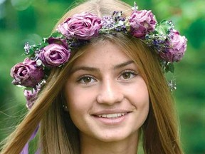 While visiting her Stratford relatives, Lovisa Fahreaus, 13, of Sweden, got the thrill of a lifetime when Justin Bieber serenaded her onstage at Toronto's Air Canada Centre with the hit One Less Lonely Girl during his show there last Thursday. She's wearing the crown of roses Bieber presented to her. (SCOTT WISHART The Beacon Herald)