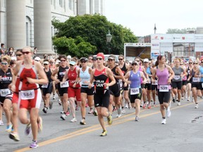 Hundreds of competitors leave the start line during the 2012 edition of the K-Town Triathlon in downtown Kingston.
Danielle VandenBrink/The Whig-Standard