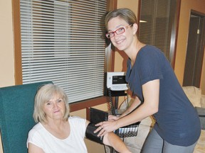 Farrell Archibald, MRPCN  chronic disease management nurse, takes  the blood pressure of Jacquie Boyd, MRPCN executive director, at the MRPCN offices on Tuesday, July 23.