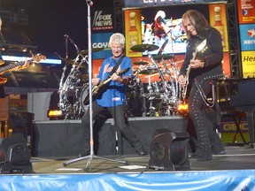 From left: bassist Bruce Hall, vocalist/guitarist Kevin Cronin and guitarist Dave Amato of REO Speedwagon perform during New York Mets Summer Concert Series on June 15, 2012 in New York City. The band plays Harbourfest in Kenora Sunday, Aug. 4.