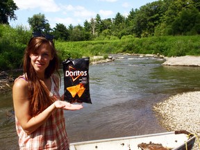 3:29 p.m. – Bethanie Wood breaks out the ‘Victory’ Doritos at the former Rock’s Mills dam site – woohoo!