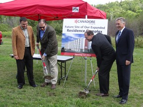 Shawn Chorney (left to right), vice-president of Enrolment Management and Student Services; William Ferguson, chair of Canadore College board of governors; Mayor Al McDonald; and Brian Freeman, Campus Living Centres vice-president, officially break ground on the college's third apartment complex. Construction is slated to start later this week.