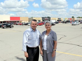 Dean Bradley, president of Brad-Lea Meadows, and Marianne Lucio, property manager for Brad-Lea Meadows, stand in front of the Thames Lea Plaza, on Tuesday, July 30, 2013, which has undergone many transformations over the years to serve the changing needs of consumers. One of Chatham's oldest shopping centres will host a re-opening on Friday, Aug. 2, 2013, from 11 a.m. to 2 p.m. (ELLWOOD SHREVE, The Daily News)