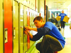 JANE DEACON HIGH RIVER TIMES/QMI AGENCY Nate Boake was one of 16 volunteers who helped out at Senator Riley Middle School on July 26. In the fall, the middle school will house Notre Dame Collegiate students while renovations on their facility are completed.