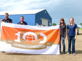 Richardson Pioneer had a flag made in celelbration of 100 years of business. On July 26, Richardson Pioneer celebrated offered beef on a bun, donuts and birthday cake at the Fairview office for the company’s 100th anniversary. Holding flag, l-r, Kerry Froese (area marketing rep, Ron Hill (Director of operations), Kelsie Kramer and Nina Stiles (admin support staff).