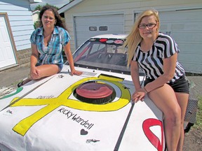 Taylor Crockford (right) painted a tribute on her Pinto stock car to friend Richard Wardell, who took his own life in 2011. Richard's mother, Darlene (left), applauds Crockford's efforts to raise awareness about teen suicide.