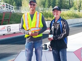 Shawn Hagen (right) was presented with the first place Wally Trophy by track manager Landon,