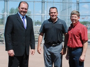 Mayor Al McDonald, North Bay Baseball Association president Chad Lacelle and Chris Winrow stand at the home plate on Field E at the Steve Omischl Sports Fields Complex, Tuesday. The NBBA will be hosting the Select Ontario Baseball Association midget provincial championship Aug. 23-25.