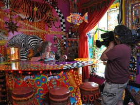 Videographer Chris Gzugus films Madoc artist Diane Woodward in her colourful home for the upcoming series Cottage Cheese, produced by the new Cottage Life channel.
