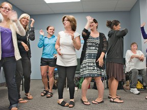 Leslie Bricker (middle), of the Ottawa-Carleton school board, leads a workshop Tuesday on the ORFF approach to teaching the arts to a group of Grand-Erie elementary teachers. (Brian Thompson, The Expositor)