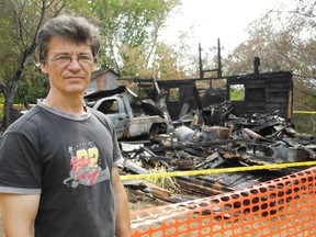 Rick Froats stands in front of the charred ruins of his garage in Osnabruck Centre, which housed thousands of dollars of tools for his woodworking and car repair hobbies. 
Staff photo/CHERYL BRINK