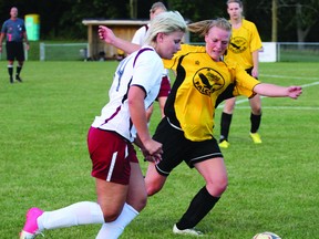 Woodstock Spurs Nicki Pall (left) gets around a Taxandria SC Falcons defender in the second half of their semi final Second Division Cup game in the London and Area Women's Soccer League Tuesday night at Cowan Park. The Spurs won 7-0 to advance to the Cup finals. (GREG COLGAN/Sentinel-Review/QMI Agency)