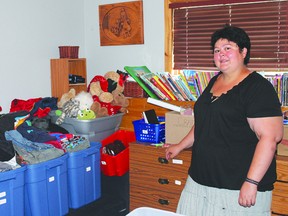 JANE DEACON HIGH RIVER TIMES/QMI AGENCY Deanna Tretiak has helped over 100 local teens cope with the aftermath of the flood by collecting donations of clothes and household items specifically for the youth of High River.