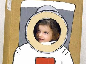 Chloe Schultz, 3, views the world as an astronaut during The Places You'll Go! space event at Stratford Rotary Complex Tuesday night. (SCOTT WISHART, The Beacon Herald)