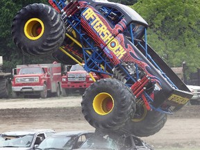 Monster truck Aftershock takes to the air in a thrilling display during the Adecco Summer Smash exhibition Saturday at Brighton Speedway.