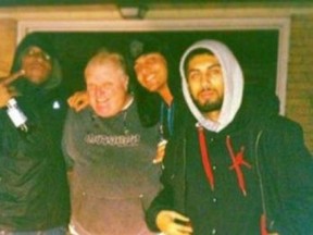 Toronto Mayor Rob Ford is seen posing with Anthony Smith, left, who was gunned down outside a King St. W. club, in a photo released by Gawker. Mohammad Khattak is seen on the right and Monir Kasim is second from the right.