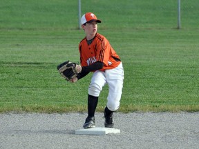 Josh Downey of the Paris Phillies gets ready to make a throw from second base during a 2013 game. SUBMITTED PHOTO