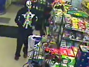 Surveillance footage from a King Street convenience store shows a suspect covering his or her face during an attempted robbery in May.