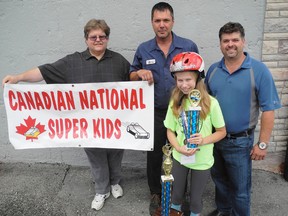 Ally Neumann, 13, (front) was recently the second runner up at the National Super Kids Classic during the All-American Soap Box Derby event last weekend in Akron, Ohio. She stands with her group of supporters including Mike Elliot (left), Gary Haviland (centre) and Ric Boyko (right). (SARAH DOKTOR Simcoe Reformer)