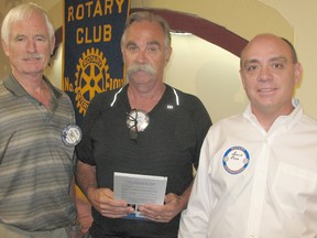 Bruce Ross, right, spoke about the innovative treatment he had to help cure his depression during a presentation at the Rotary Club of Chatham on July 31. With him are club members Barry Fraser and Al Morka.