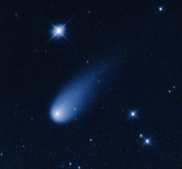 Comet ISON hurtling toward the Sun at 48,000 miles per hour is captured in this time-lapse image made from a sequence of pictures taken May 8, 2013, by NASA's Hubble Space Telescope. At the time the images were taken, the comet was 403 million miles from Earth, between the orbits of Mars and Jupiter. (NASA, ESA, and the Hubble Heritage Team (STScI/AURA)/Handout)