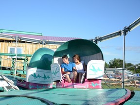 ryan paulsen ryan.paulsen@sunmedia.ca
Benjamin Grandmaison and Laura Bitterworth get slightly dizzy on the Tilt-a-Whirl ride during the fun and games at this year’s Beachburg Fair, which was held last weekend. The Eganville Fair picks up the slack, starting today. For more community photos please visit our website photo gallery at www.thedailyobserver.ca.