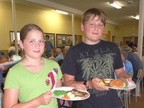 The Kincardine United Church held its annual Fish Fry on July 23, 2013. Cate Crawford and Sean Thompson fill their plates for dinner. (ALANNA RICE/KINCARDINE NEWS)