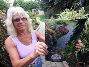 Karen (pictured here) and husband Ron Banks were pleasantly surprised to find their backyard featured on the cover of the 2013 main Garden Tools by Lee Valley catalogue. The Banks garden is also one of six featured in the 13th annual Tillsonburg Lioness Garden tour, scheduled for Saturday, August 10 from 1-5 p.m. Those seeking tickets ($10) or more information, are invited to call 519-842-3900. Jeff Tribe/Tillsonburg News