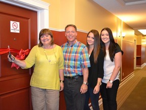 Linda Mangnall cuts the ribbon on room 331 at the Ronald McDonald House Northern Alberta with her husband, Steve and daughters Stephanie and Serena.
Submitted