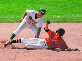 Sherwood Park Midget AAA Dukes infielder Colin Hoppe applies the tag to put out a Calgary Dinos runner during action earlier this summer. Photo courtesy Cheryl Moskaluk