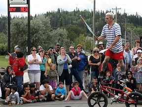 Sean “Bike Boy” Bridges of Australia jokes and banters with McMurrayites, as he juggles knives on a bike at TransAlta’s 2012 InterPlay festival. Bridges also juggled torches, fruit and chainsaws during the show. TODAY FILE PHOTO