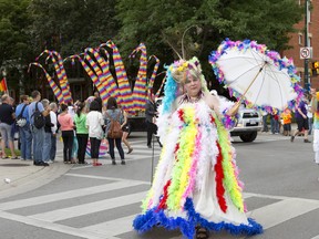 Ronald Trumble sports a self-described ?fun and feathery? outfit in London?s Pride Parade last Sunday. (CRAIG GLOVER, The London Free Press)