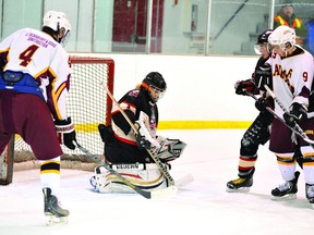 Brockville Tikis goalie Nathan Peters makes a save in a playoff game last season against the Athens Aeros. Peters is one of several key players expected to be back in the team's lineup for the 2013-2014 season. (RECORDER AND TIMES FILE PHOTO)