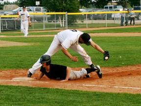 White Sox first baseman Scott Hornstra stretches out to haul in a throw, and double off a Fort Saskatchewan runner, during the final regular season league game for the Sox, who won 7-6. - Gord Montgomery, Reporter/Examiner