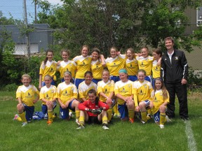 The Cataraqui Clippers U12 girls soccer team, with coach Ken Cross at right, have a chance to win $125,000 if they can win a national online contest.