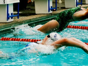 Brianna Weber (neaest lane) along with the other competitors in the 50m backstroke take off from the start line during the Stony Plain Sharks annual swim meet, held on July 26 and 27. Weber turned in a terrific swim to take top honours in this heat as she, along with her teammates, combined to win the overall points title at the meet. - Gord Montgomery, Reporter/Examiner