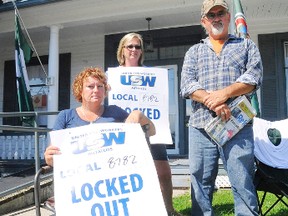 Locked out steelworkers Twila Smith (left), Tracy Graham, and Wayne Whetherup picket in front of local MP Diane Finley's office in downtown Simcoe on Thursday. The United Steelworkers Local 8782 plan to hold a protest there Friday. (DANIEL R. PEARCE Simcoe Reformer)