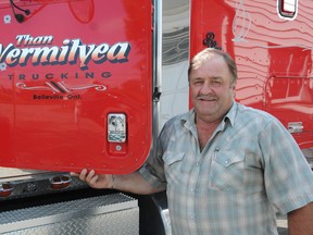 Than Vermiliyea stands with his truck at his home just north of Belleville. At 58-years-old, Vermiliyea was named the owner/operator of the year for 2013 by Truck News.