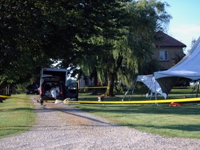 Workers were shocked erecting this tent for a family wedding at a home on LaSalle Line near Watford Thursday, after one of the tent poles struck the overhanging power wires. One male died, three were taken to hospital with serious injuries. (PAUL OWEN, The Observer)