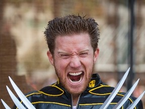 Tom Roy poses while dressed as comic book character Wolverine during Comic-Con International in San Diego, Calif., on July 18. (Fred Greaves/Fred Greaves)