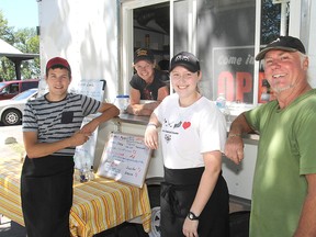Ian Attema, left, Melanie Kerr, Emily Grainger and Mike Nuttall of Logan’s Lunch food truck at Lake Ontario Park. ( Michael Lea/The Whig-Standard)